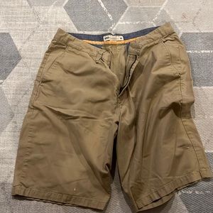 Vans 36 inch khaki shorts preowned see photo where the bleach stain is
